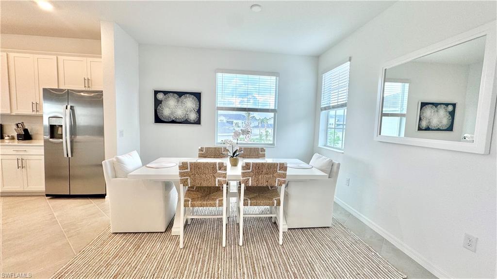 Coastal dining nook with mirror