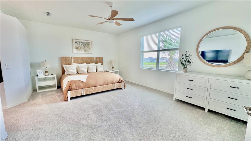 Primary king bed with mirror and TV